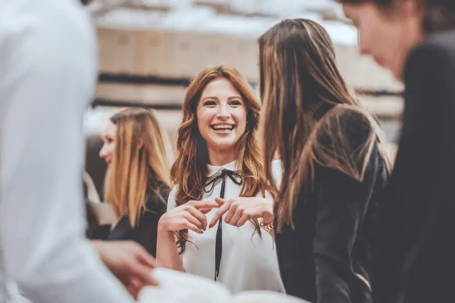 Image of a woman smiling and networking