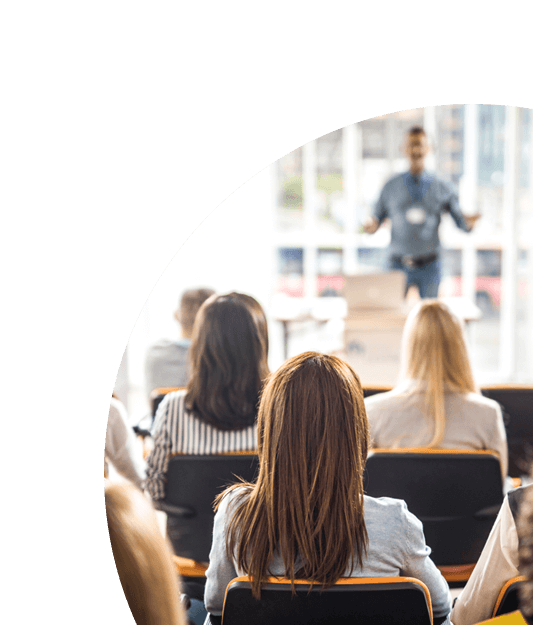 Image of a man speaking to a group